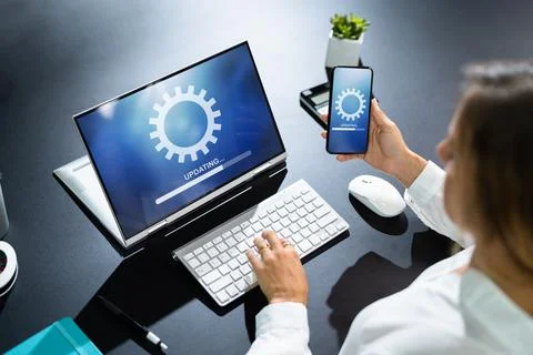 Woman Doing Software Update On Mobile Phone Stock Photos