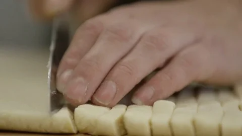 Woman doing some baking in Tromsø, Norway, cutting close Stock Footage 76566747