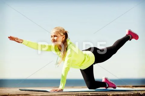 Woman doing sports outdoors Stock Photos