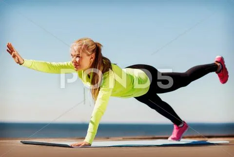 Woman doing sports outdoors Stock Photos