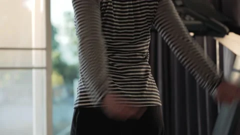 Woman doing warm up exercise by twisting her waist. Stock Footage 220244680