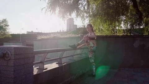 Woman doing warm-up before running Stock Footage 79590171