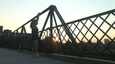 Woman doing warn up in the bridge Stock Footage 11939554