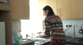 Woman doing the washing up in a rush HD Footage