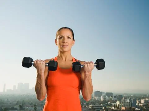Woman doing weight training Stock Photos