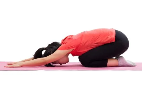 Woman doing yoga child pose Stock Photos