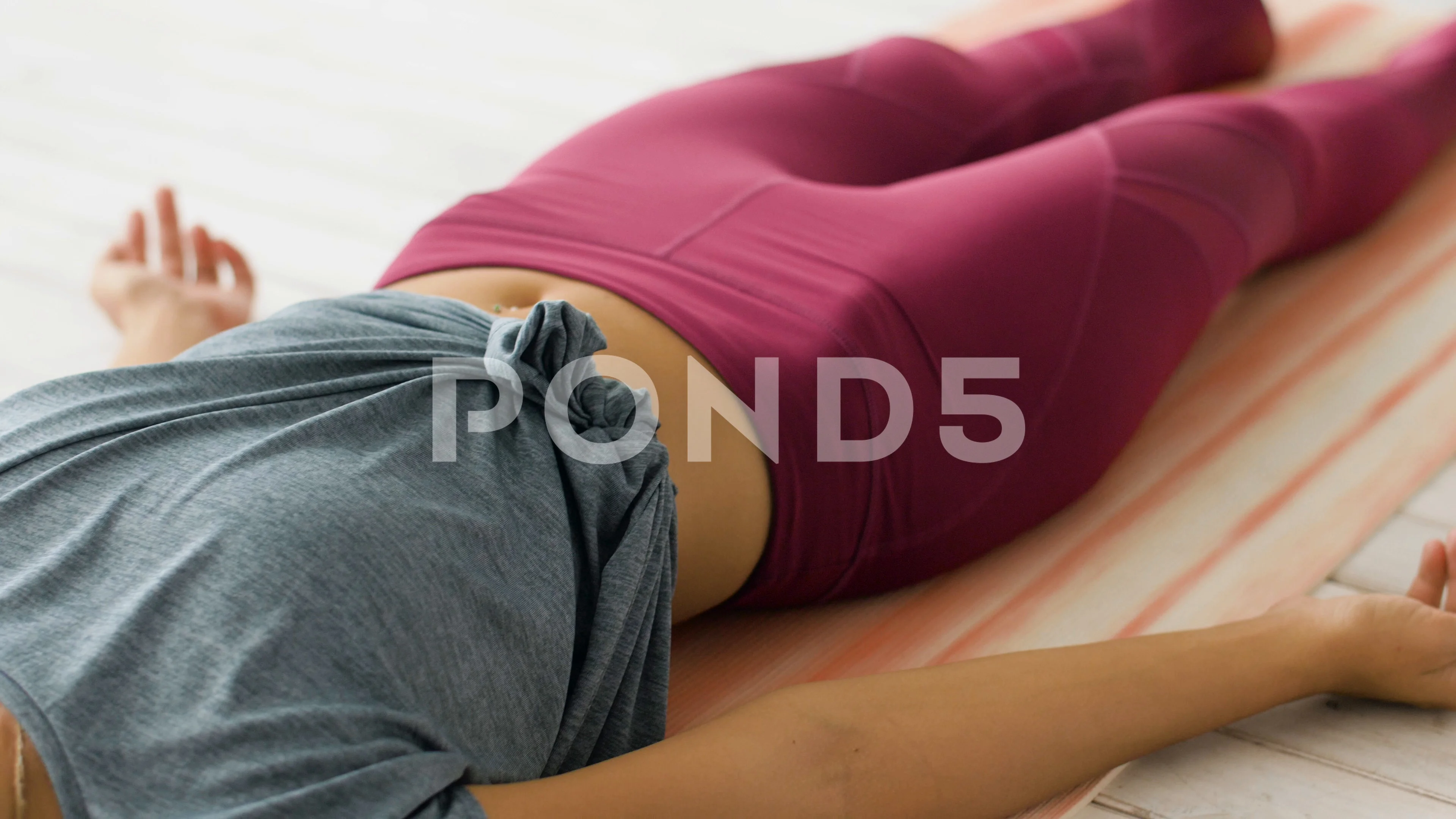 Constructive Rest Pose, Corpse Pose Variation Bent Legs, Beautiful Girl  Practice Savasana Variation Bent Legs. Young Attractive Woman Practicing  Yoga Exercise. Working Out, Black Wearing Sportswear, Grey Pants And Top,  Indoor Full