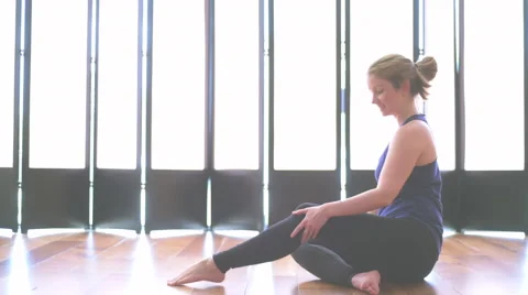 Woman doing yoga in a studio medium shot 動画素材 64349096