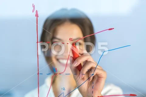 The woman draw the graph at the virtual screen Stock Photos