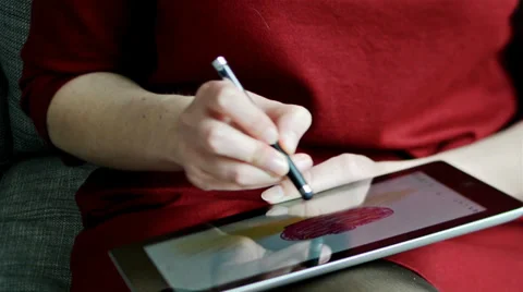 Woman drawing apple on tablet computer Stock Footage 37890709