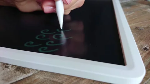 Woman draws a pattern on the graphic tablet, education online Stock Footage 201216171