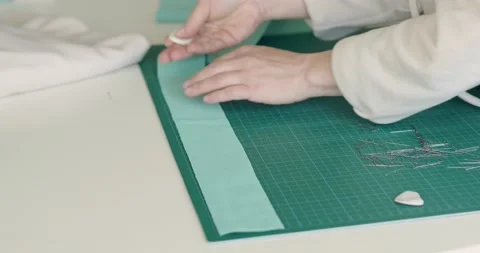 Woman draws with soap markup patterns on fabric. Atelier design studio concept Stock-Footage 200453974