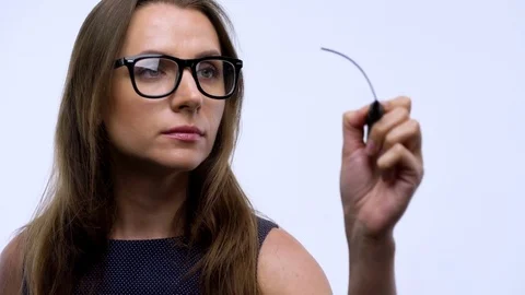 Woman draws various growth charts, calculating prospects for success in a modern Stock Footage