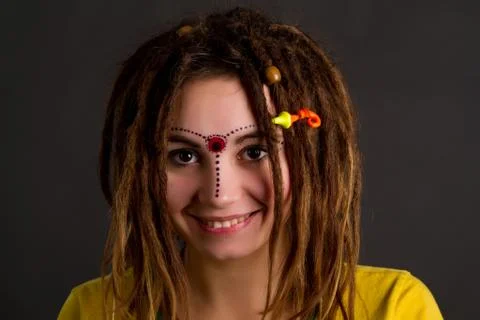 Woman with dreadlocks  on a gray background Stock Photos