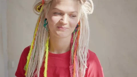 Woman with dreadlocks looking at camera and smiling Stock Footage 139299467