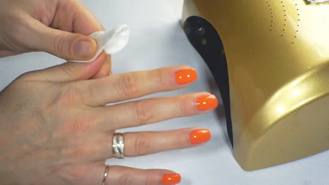Woman dries her nails with shellac in UV lamp. Close-up. Stock Footage 101776878