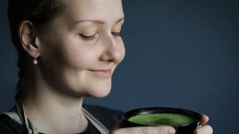 Woman drink matcha green tea Stock Footage