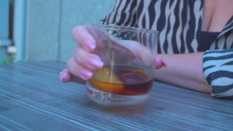 Woman drinking aperitif Stock Footage 145778055