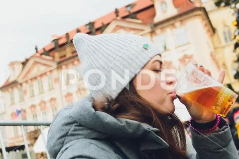 Woman drinking beer in bar terrace on the street. Stock Photos