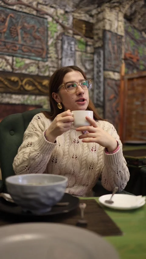 Woman drinking coffee in cafe Stock Footage 330904129