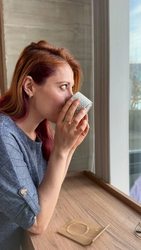 Woman drinking coffee Stock Footage 312841676
