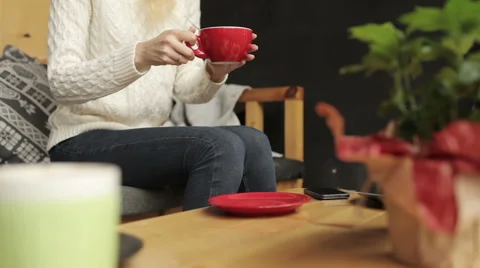 Woman Drinking Coffee While Sitting in a Cafe Video stock 65502825