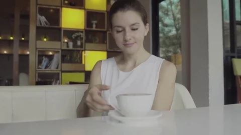 Woman drinking a hot coffee Stock Footage 81747341
