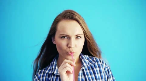 Woman drinking juice Stock Footage