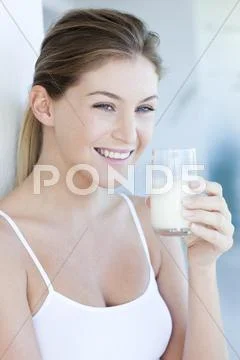 Woman drinking milk Stock Photos