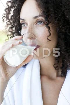 Woman drinking milk Stock Photos