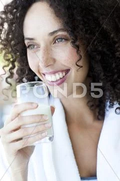 Woman drinking milk Stock Photos