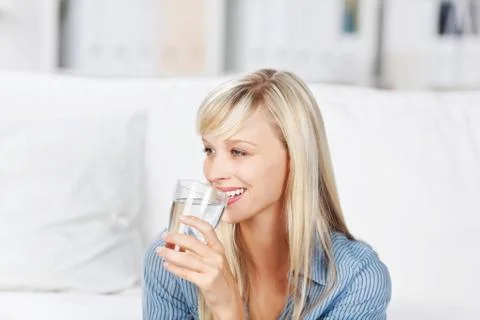 Woman drinking mineral water Stock Photos