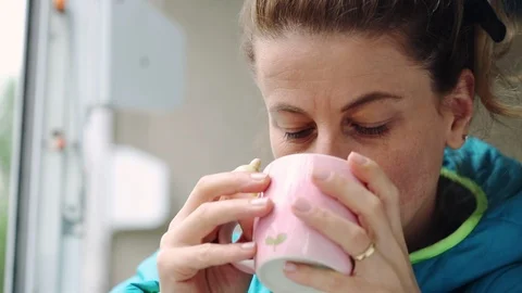 Woman drinking tea Stock Footage 98092178