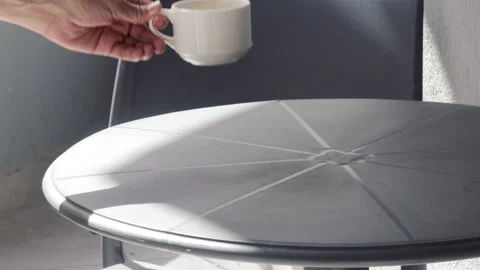 Woman drinking tea or coffee from white ceramic cup at balcony Vidéo 218804657