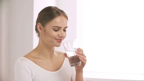 Woman Drinking Water From Glass And Look... | Stock Video | Pond5