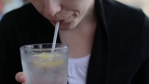 Woman Drinking Water with Lemon at Restaurant Stock Footage 73482953