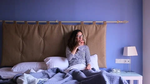 Woman drinking wine on the bed Stock Footage 68652797