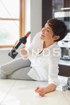 Woman drinking wine from the bottle Stock-Fotos