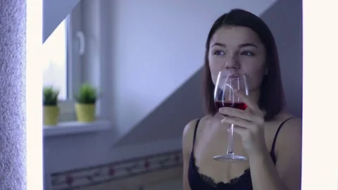 Woman drinking wine Stock Footage 69912924
