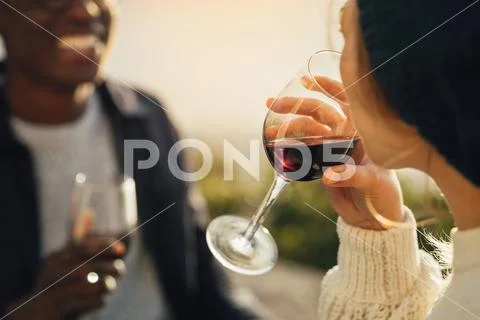 Woman drinking wine on picnic with boyfriend Stock Photos