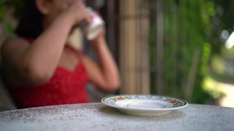 Woman Drinks Coffee From Cup Kept in Sharp Focus Stock Footage 343360454