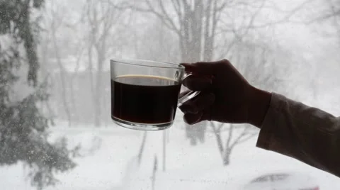 Woman Drinks Coffee Next to Snow and Window Stock Video Stock Footage