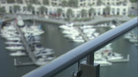 A woman drinks coffee while standing on her balcony. Stock Footage 46867418