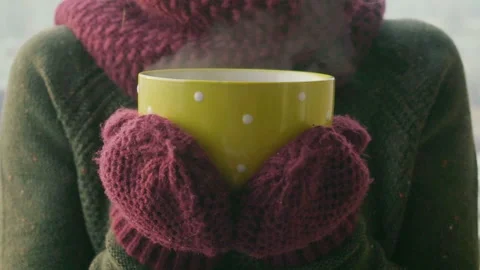 Woman Drinks Hot Tea or Coffee From yellow Cup on Winter Morning Stock Footage 86249727