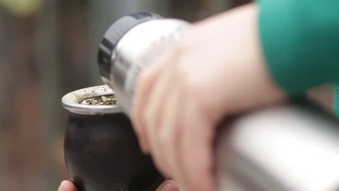 woman drinks yerba mate while sipping and chatting with green diver 스톡 동영상 123800008