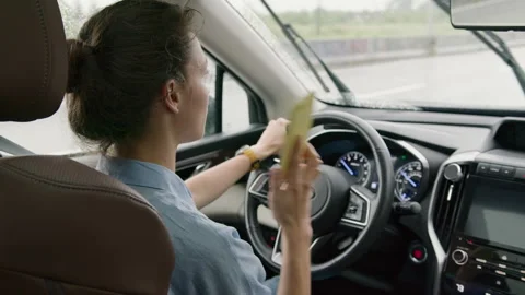 Woman driver talking on the phone while driving a car Stock Footage 263159880