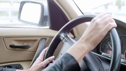 A woman driving a car Stock Footage