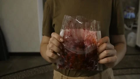 Woman drop the pack of cherry on the table Stock Footage 140602272