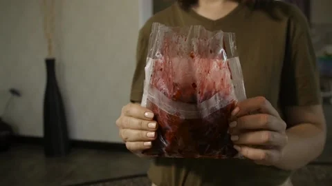 Woman drop the pack of cherry on the table Stock Footage 140602325