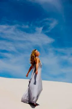 Woman on a dune Stock Photos